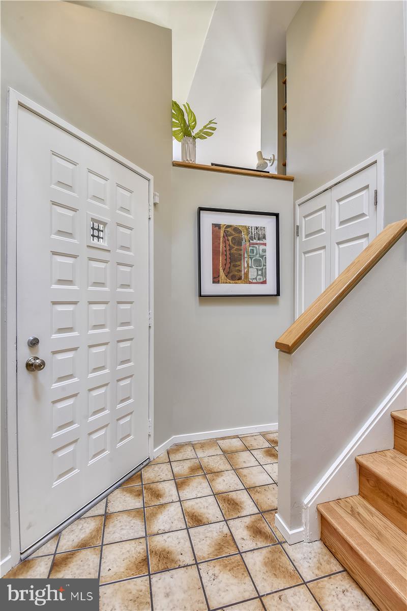 2021 Turtle Pond Drive Reston, VA 20191 - Photo 3 of 57 Entry foyer with ceramic tile floor and cedar wall
