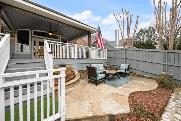 a backyard of a house with outdoor seating