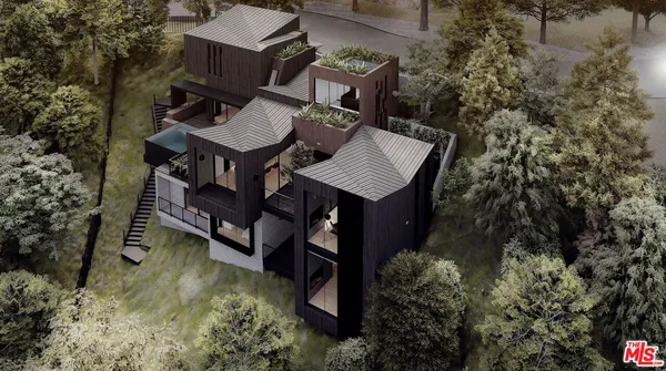 an aerial view of a house with balcony and mountain view