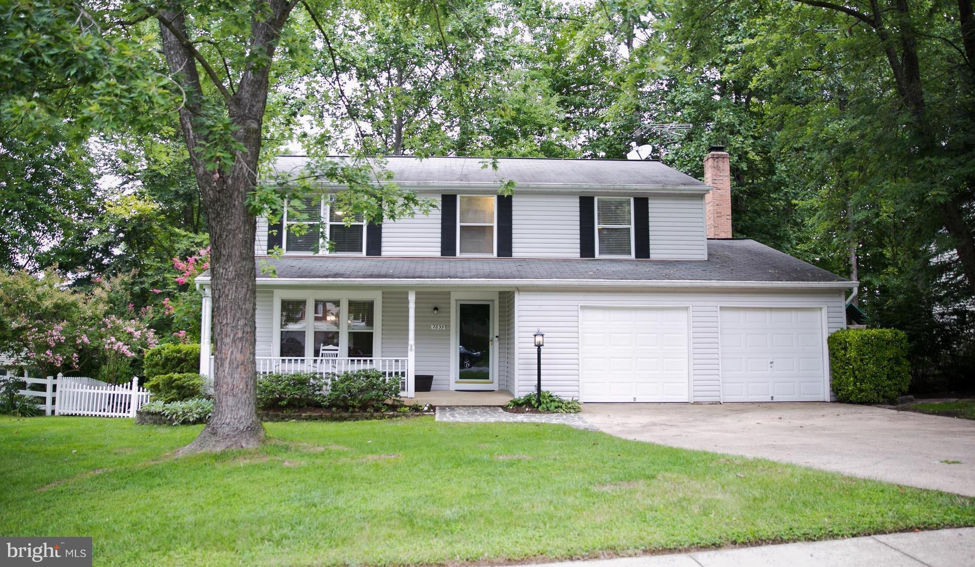 front view of a house with a garden