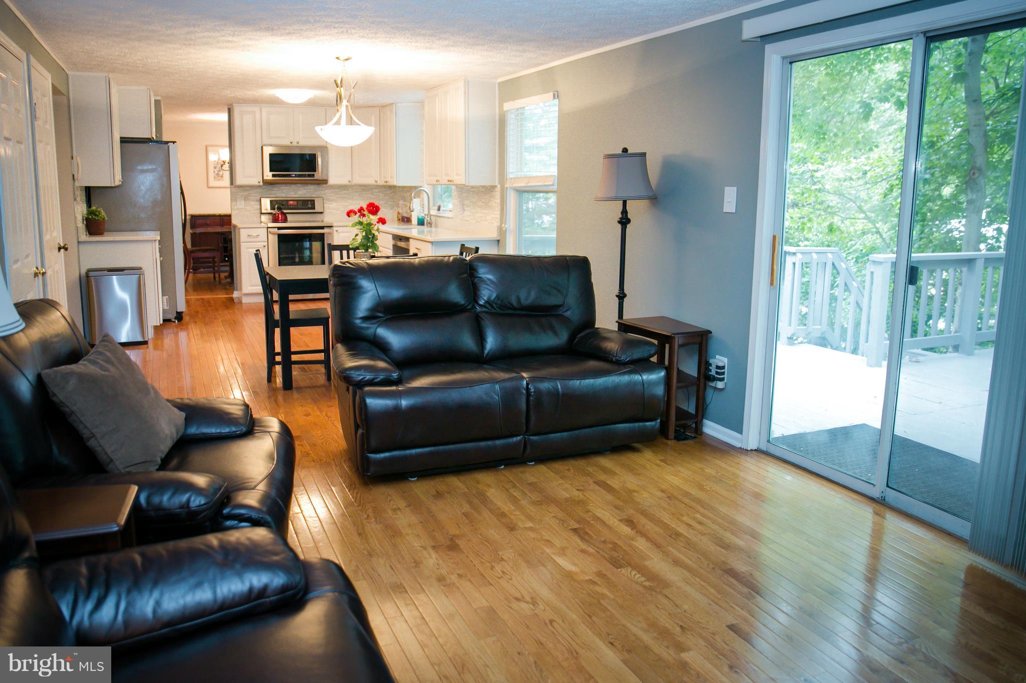 7835 Roundabout Way Springfield, VA 22153 - Photo 12 of 26 a living room with furniture and a large window