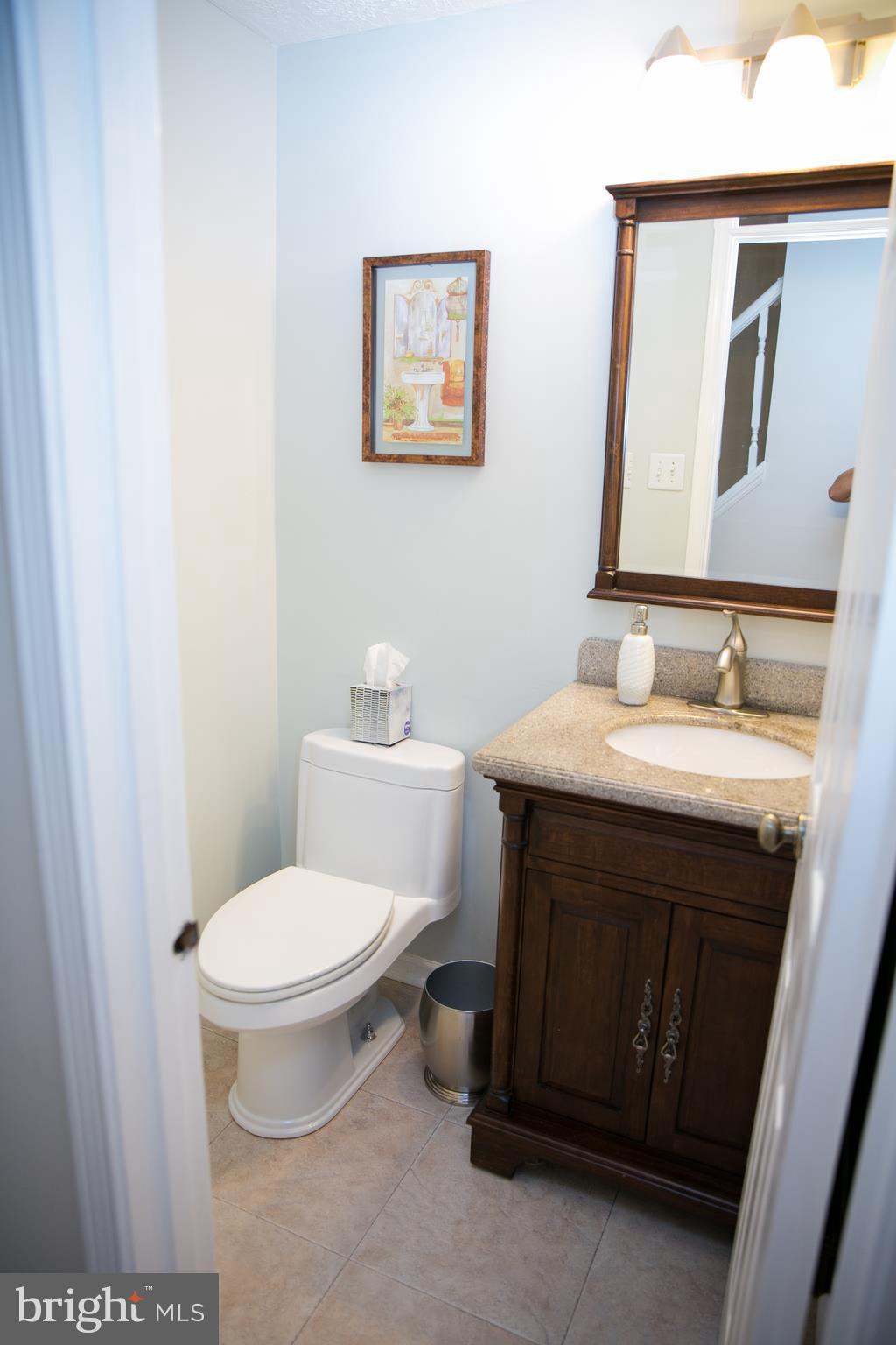 7835 Roundabout Way Springfield, VA 22153 - Photo 13 of 26 a bathroom with a sink toilet and vanity