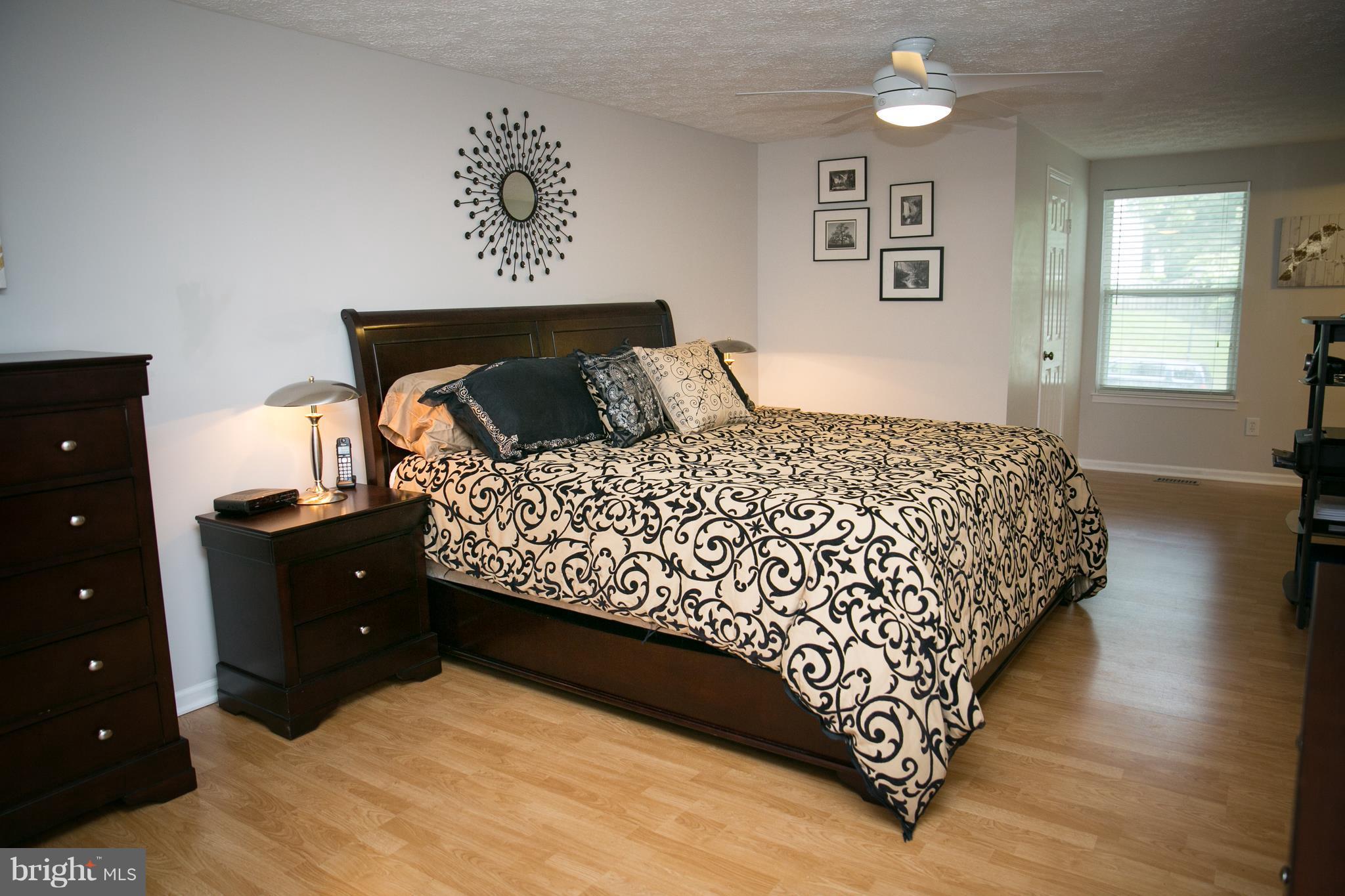 7835 Roundabout Way Springfield, VA 22153 - Photo 14 of 26 a bedroom with a bed and window