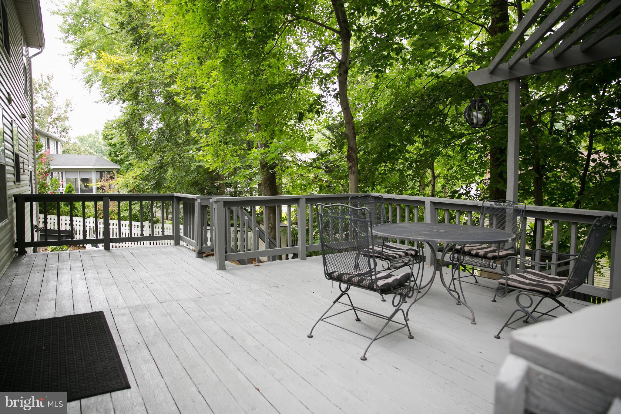 7835 Roundabout Way Springfield, VA 22153 - Photo 22 of 26 a view of balcony with furniture and wooden floor