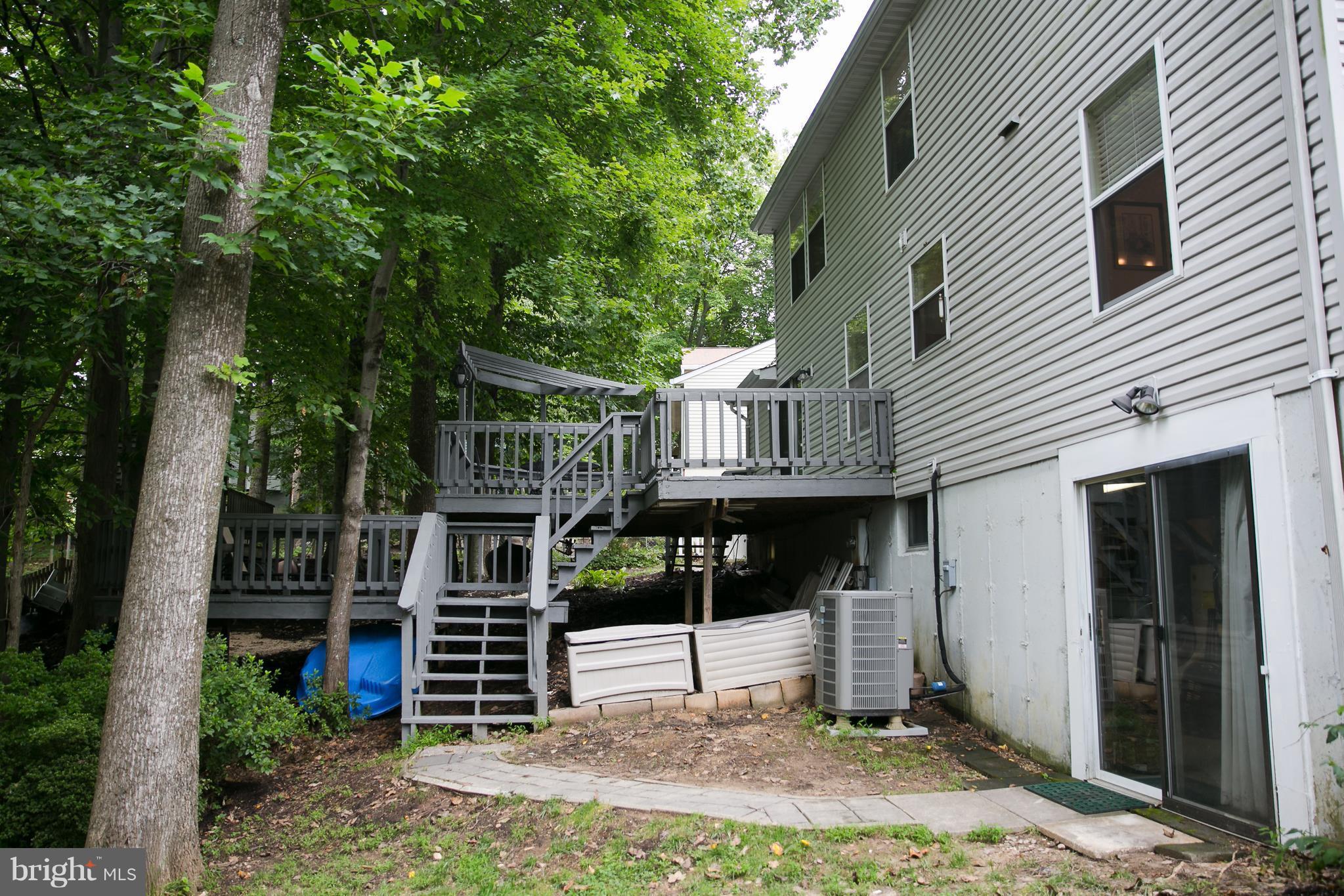 7835 Roundabout Way Springfield, VA 22153 - Photo 25 of 26 a front view of a house with garden