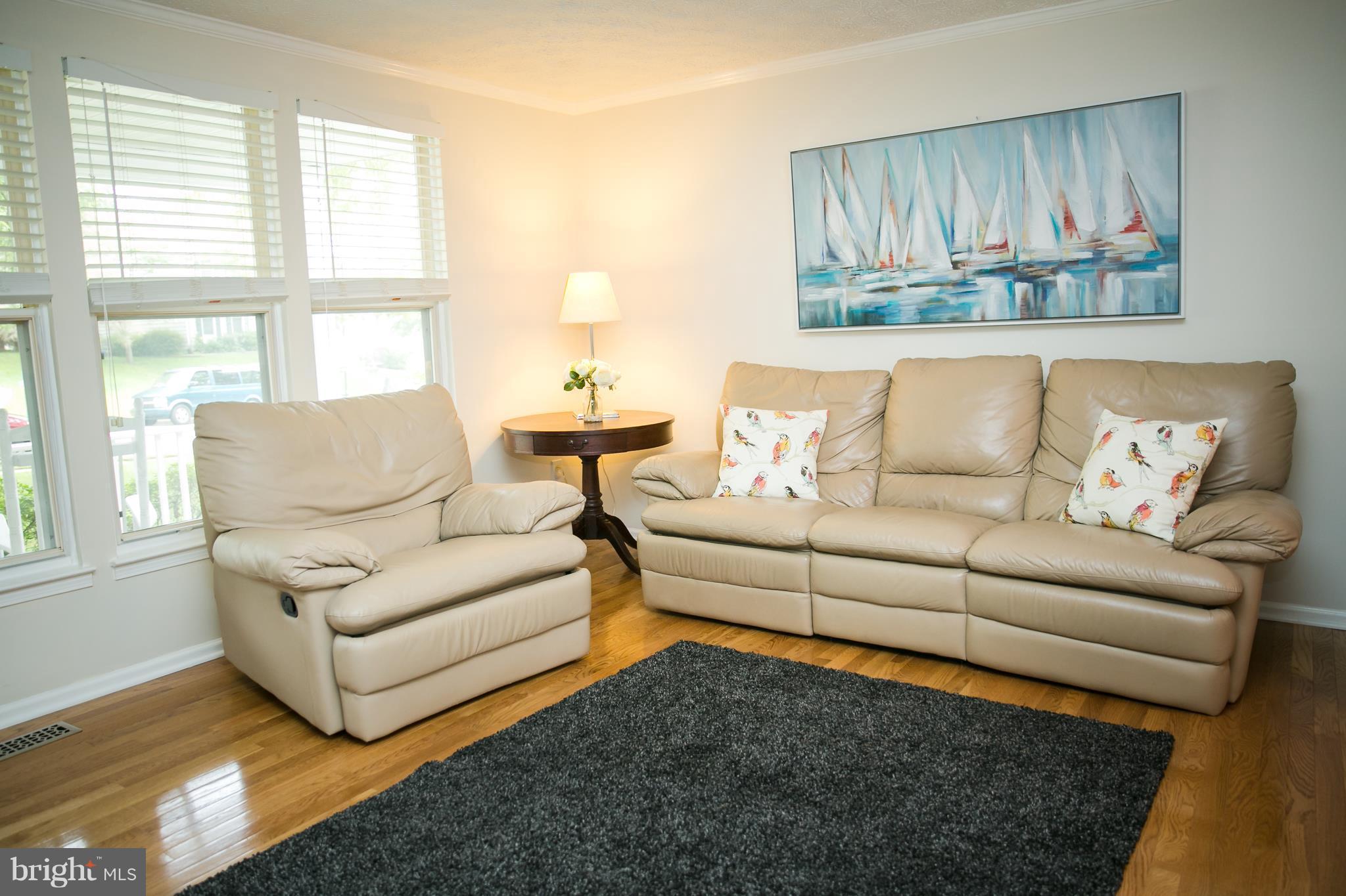 7835 Roundabout Way Springfield, VA 22153 - Photo 4 of 26 a living room with furniture and a large window
