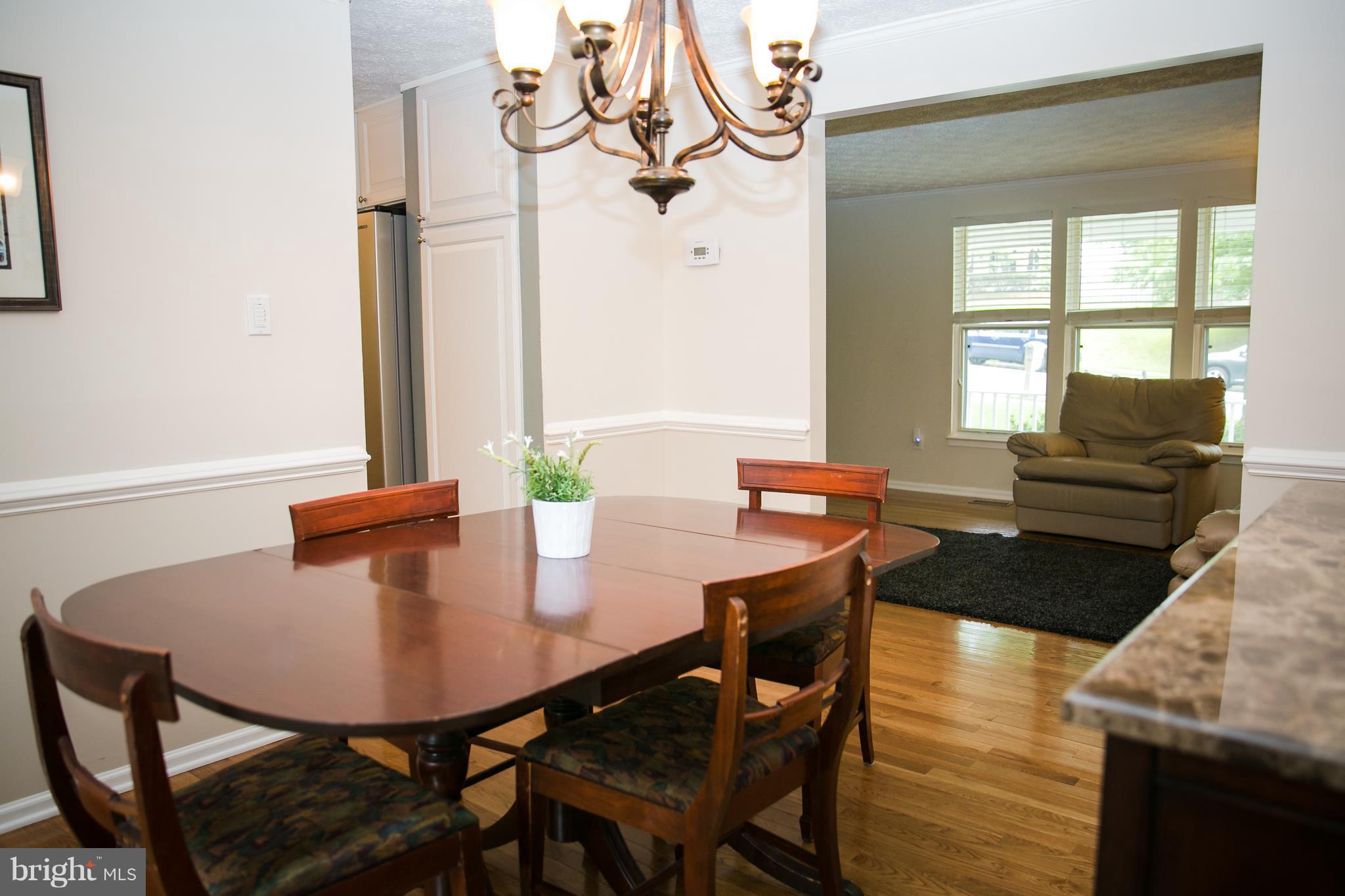 7835 Roundabout Way Springfield, VA 22153 - Photo 7 of 26 a view of a dining room with furniture and window