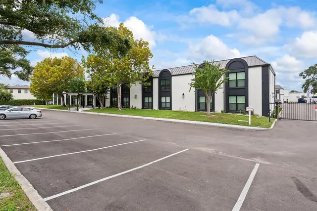 a view of a building with a large trees