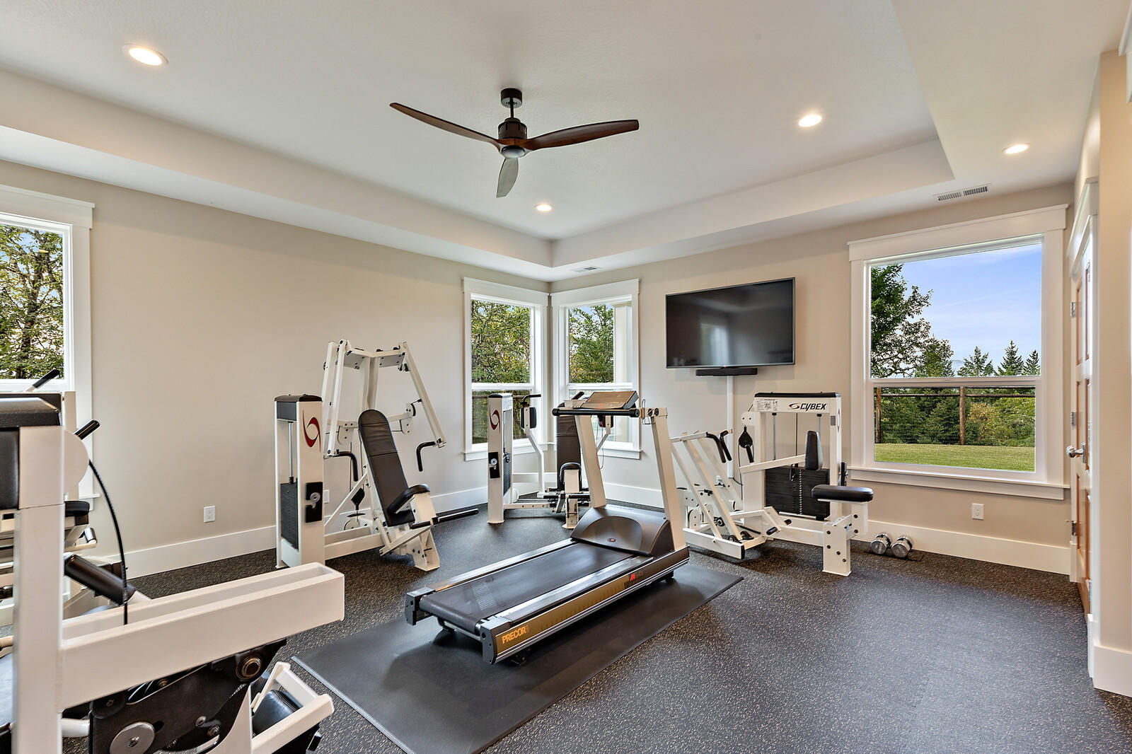 1882 Stewart Road Grants Pass, OR 97526 - Photo 38 of 44 a living room with gym equipment and a flat screen tv