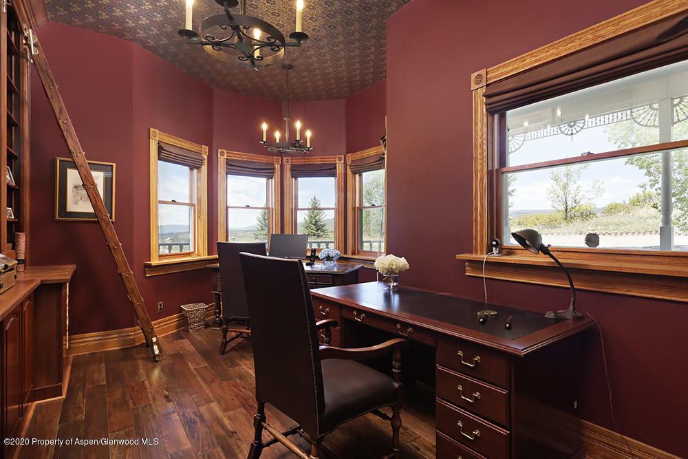 880 Buck Point Road Carbondale, CO 81623 - Photo 13 of 40 a view of a workspace with furniture and chandelier