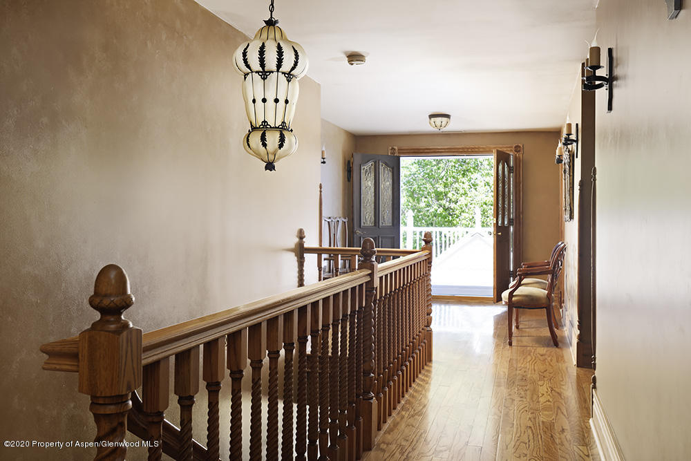 880 Buck Point Road Carbondale, CO 81623 - Photo 17 of 40 a view of entryway and hall with wooden floor