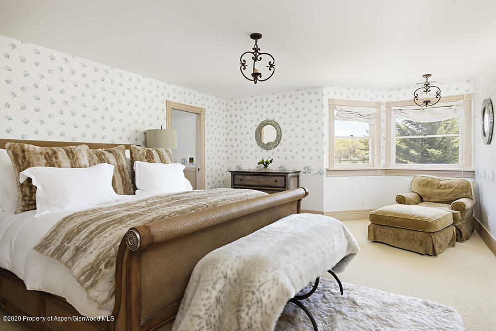 880 Buck Point Road Carbondale, CO 81623 - Photo 20 of 40 a bedroom with two beds and a window