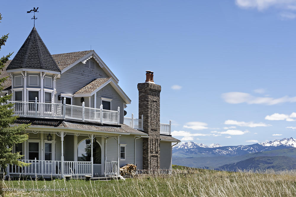 880 Buck Point Road Carbondale, CO 81623 - Photo 2 of 40 a front view of a house with a yard