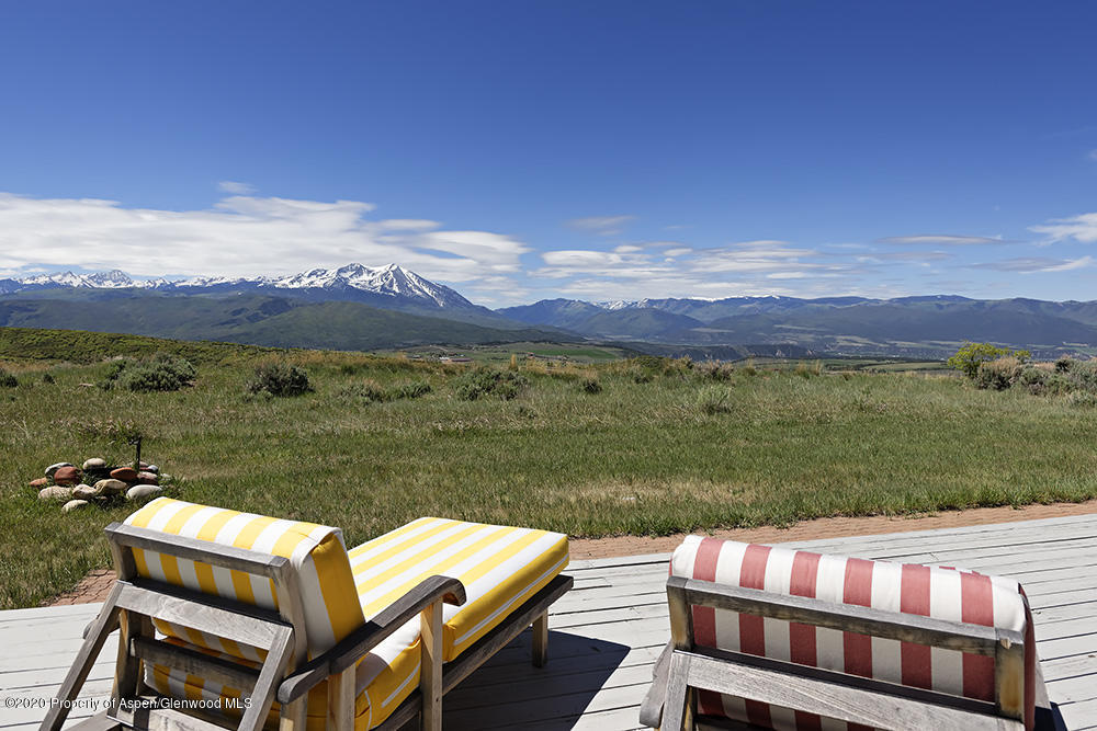 880 Buck Point Road Carbondale, CO 81623 - Photo 30 of 40 a view of a chairs and table on the lake