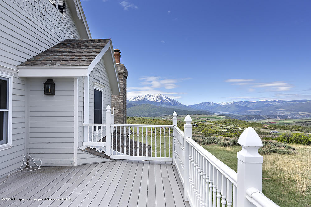 880 Buck Point Road Carbondale, CO 81623 - Photo 36 of 40 a view of a balcony with wooden floor and fence