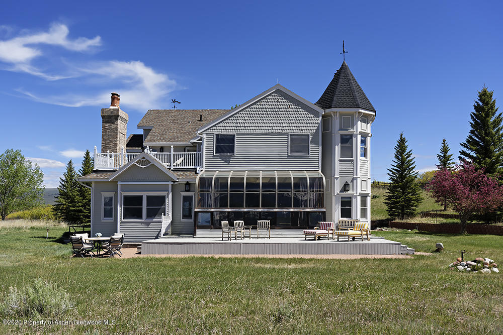 880 Buck Point Road Carbondale, CO 81623 - Photo 39 of 40 a front view of a house with swimming pool and yard