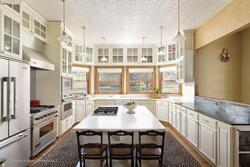 880 Buck Point Road Carbondale, CO 81623 - Photo 7 of 40 a kitchen with stainless steel appliances granite countertop a stove a sink and a refrigerator
