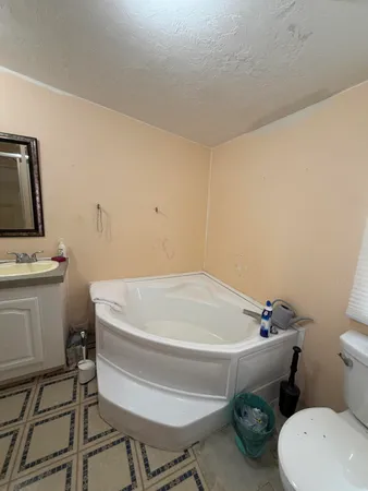 a bathroom with a sink and toilet