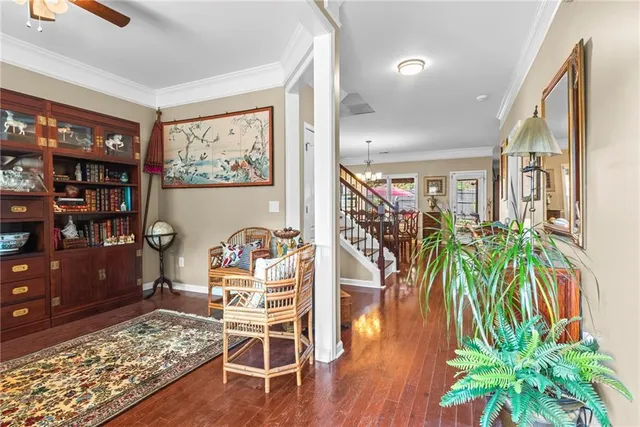 a dining room with furniture and wooden floor