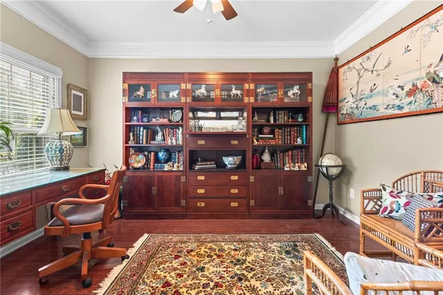 a room with furniture and book shelf