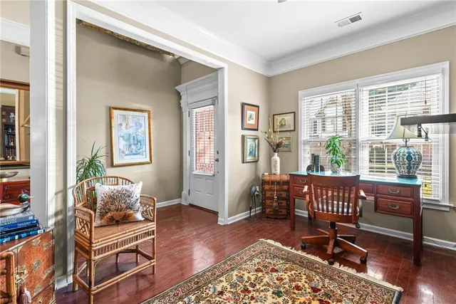 a living room with furniture and windows
