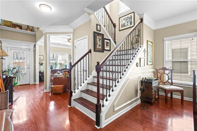 a view of entryway livingroom and hall with wooden floor