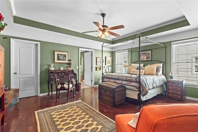 a bedroom with two beds and a rug