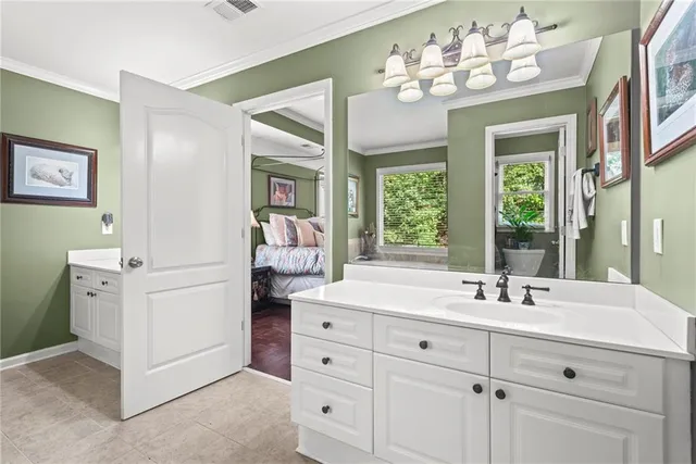 a bathroom with a sink double vanity and a mirror