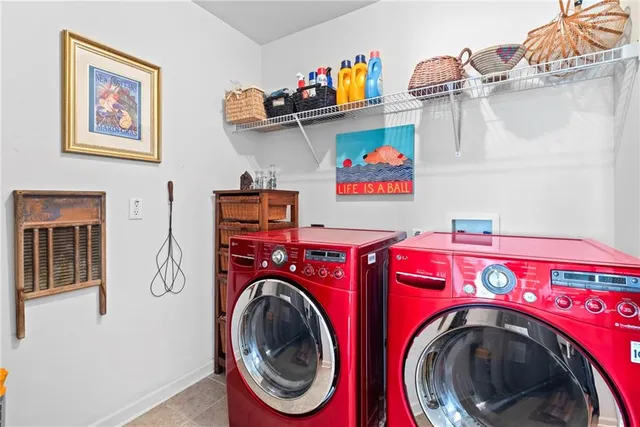 an aerial view of multiple houses with yard