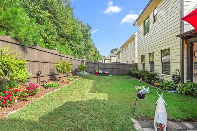 a backyard of a house with lots of green space