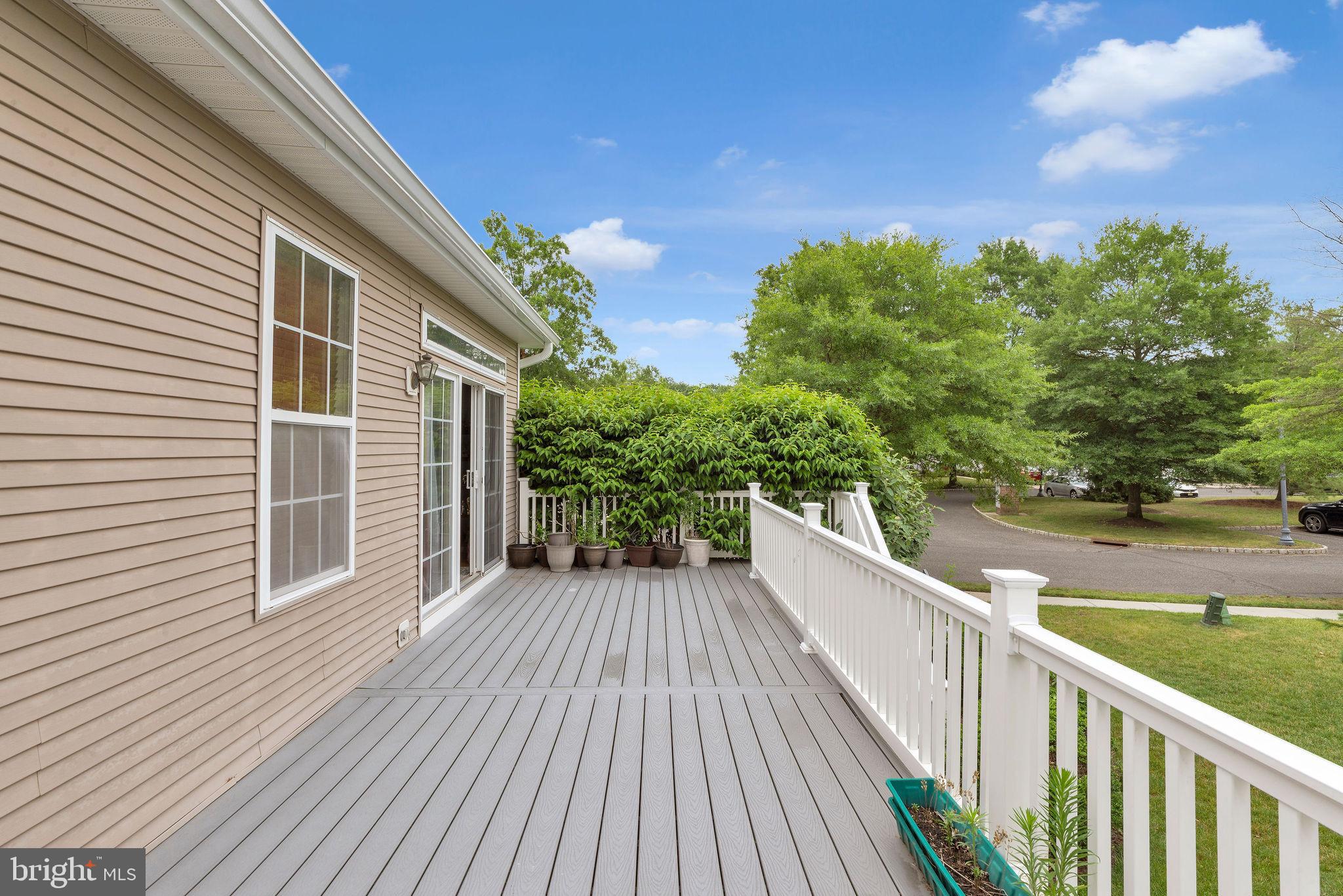 16 Cardiff Court Princeton Junction, NJ 08550 - Photo 41 of 60 a view of a balcony with wooden floor