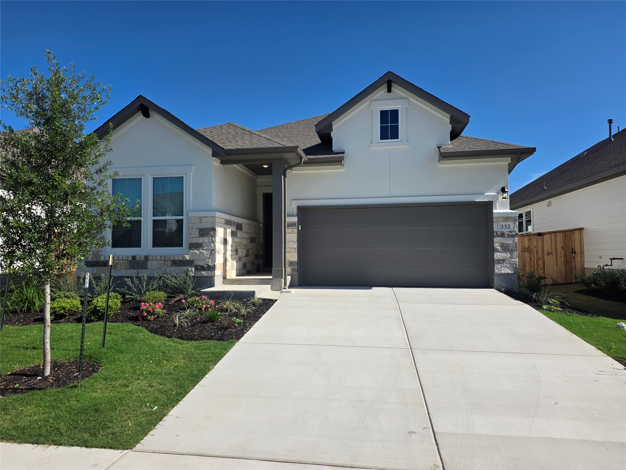 332 Marisol Bend Georgetown, TX 78626 - Photo 1 of 31 a front view of a house with a yard and trees