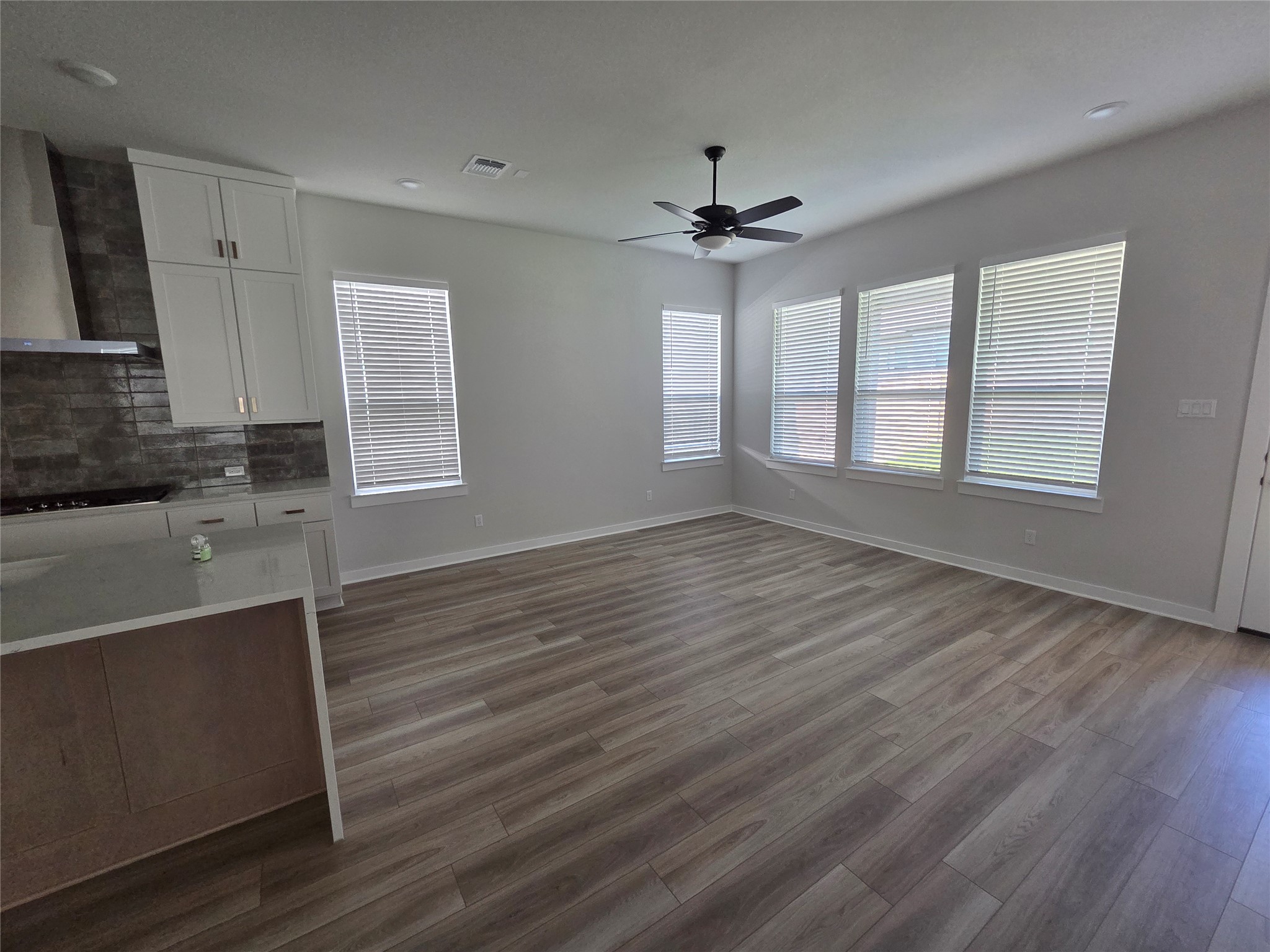 332 Marisol Bend Georgetown, TX 78626 - Photo 9 of 31 a view of wooden floor and cabinet in a room