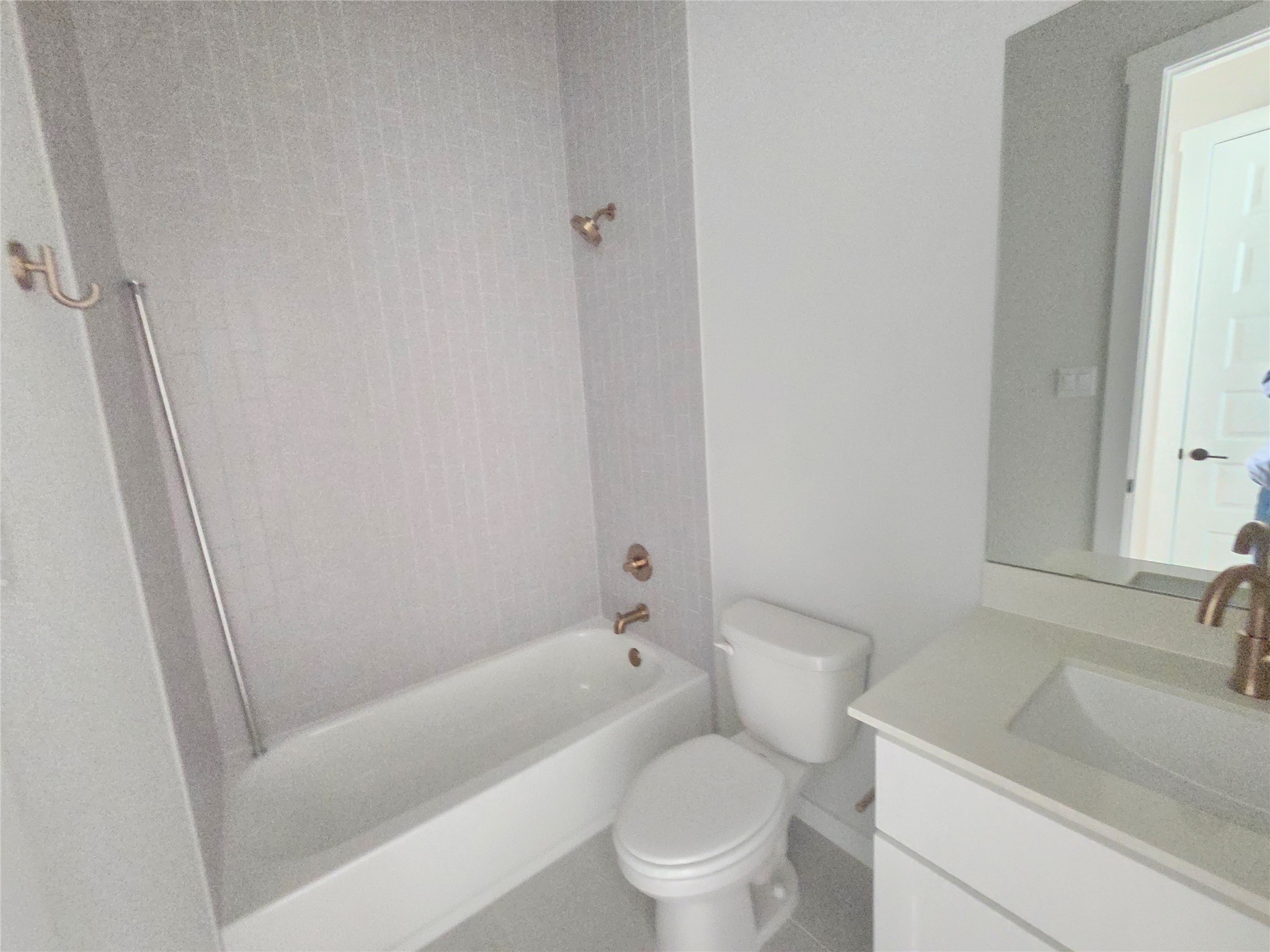 332 Marisol Bend Georgetown, TX 78626 - Photo 14 of 31 a white toilet sitting next to a bath tub