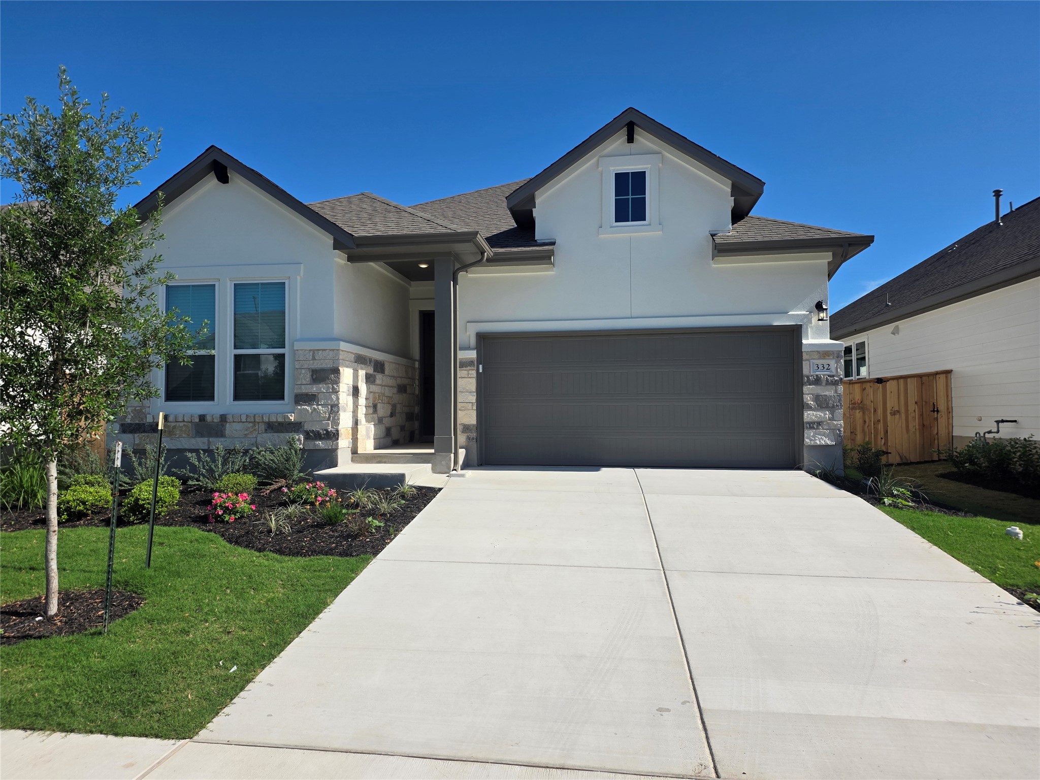 332 Marisol Bend Georgetown, TX 78626 - Photo 2 of 31 a front view of a house with a yard and garage