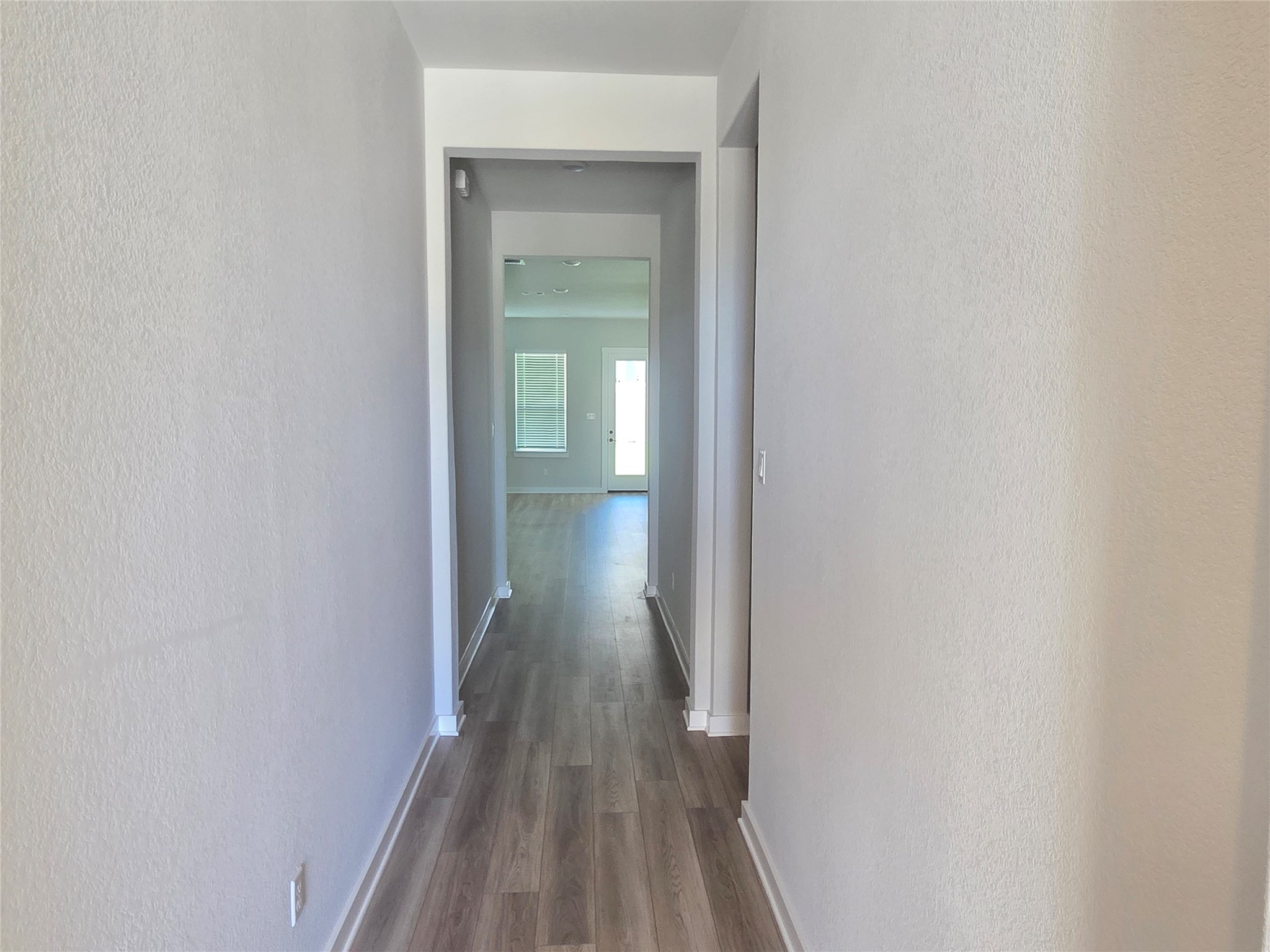 332 Marisol Bend Georgetown, TX 78626 - Photo 18 of 31 a view of a hallway with wooden floor