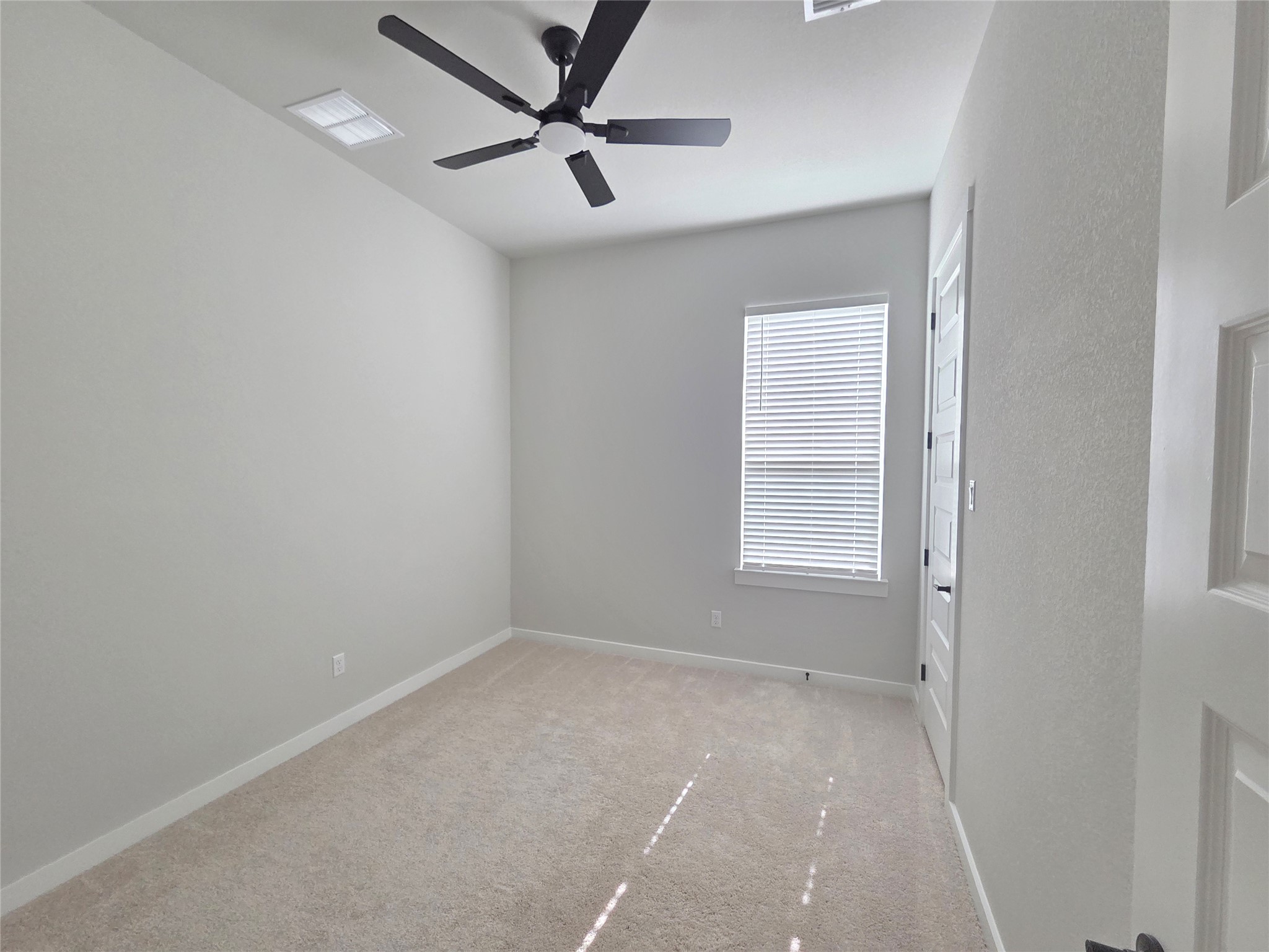 332 Marisol Bend Georgetown, TX 78626 - Photo 22 of 31 an empty room with a window and ceiling fan