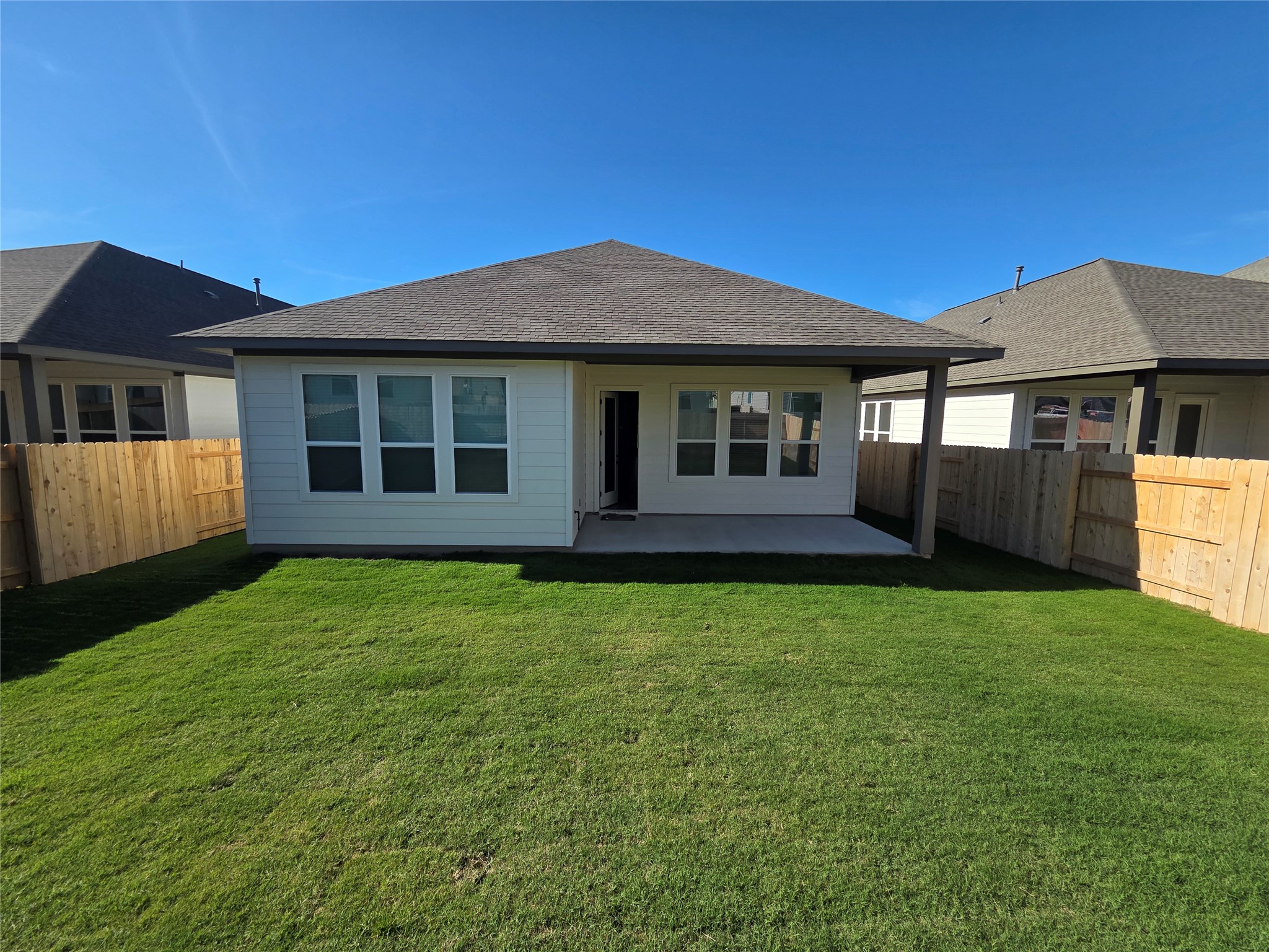 332 Marisol Bend Georgetown, TX 78626 - Photo 26 of 31 a house with huge green field in front of it