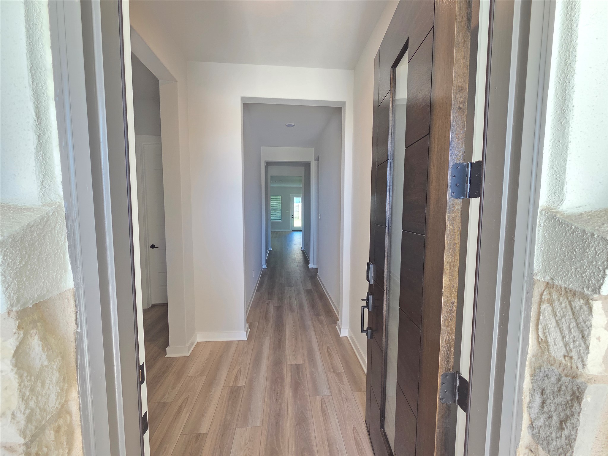 332 Marisol Bend Georgetown, TX 78626 - Photo 4 of 31 a view of a bedroom from a hallway