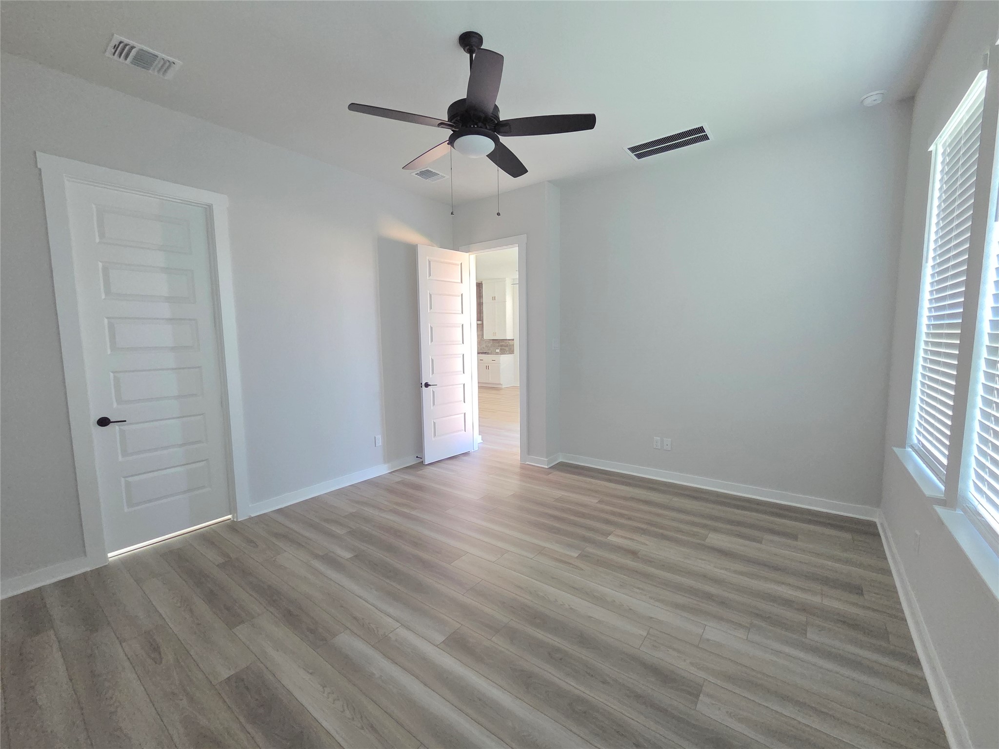 332 Marisol Bend Georgetown, TX 78626 - Photo 6 of 31 wooden floor in an empty room with a window