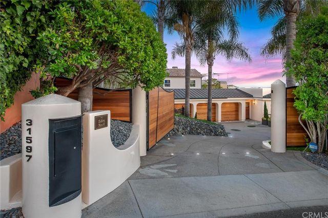 a view of a livingroom with furniture and hardwood floor