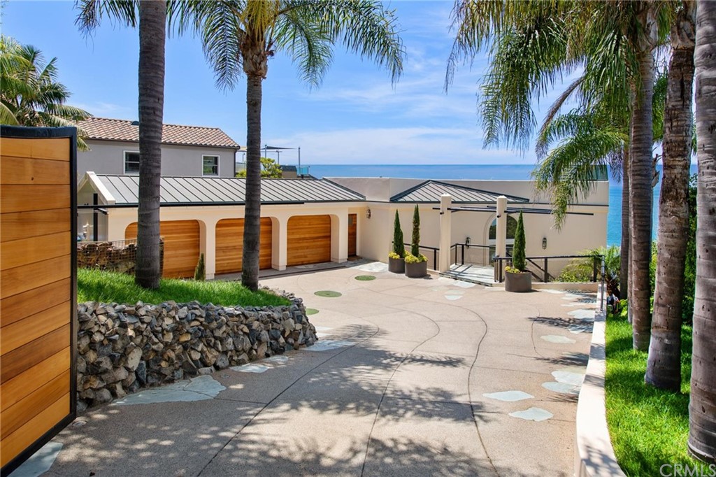 31597 Table Rock Drive Laguna Beach, CA 92651 - Photo 21 of 75 a view of a house with a yard and palm trees