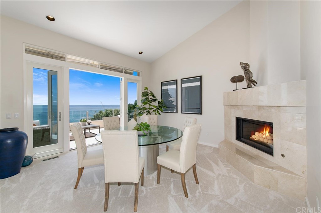 31597 Table Rock Drive Laguna Beach, CA 92651 - Photo 31 of 75 a dining room with furniture and a fireplace