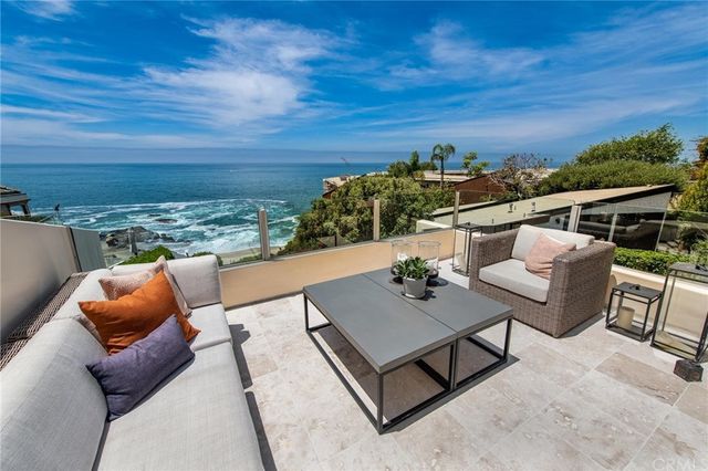 a outdoor living space with furniture and city view
