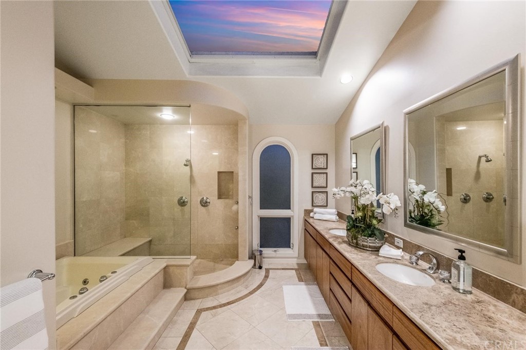 31597 Table Rock Drive Laguna Beach, CA 92651 - Photo 40 of 75 a spacious bathroom with a granite countertop tub sink and mirror