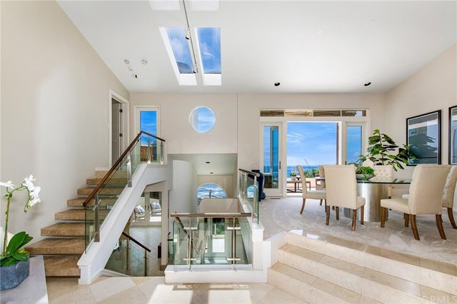 a living room with furniture and a clock