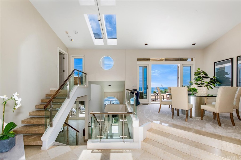 31597 Table Rock Drive Laguna Beach, CA 92651 - Photo 4 of 75 a living room with furniture and a clock