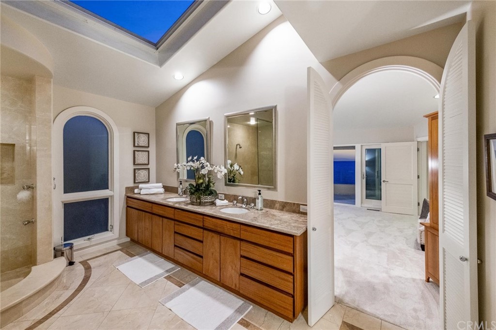 31597 Table Rock Drive Laguna Beach, CA 92651 - Photo 41 of 75 a spacious bathroom with a granite countertop sink a mirror and shower