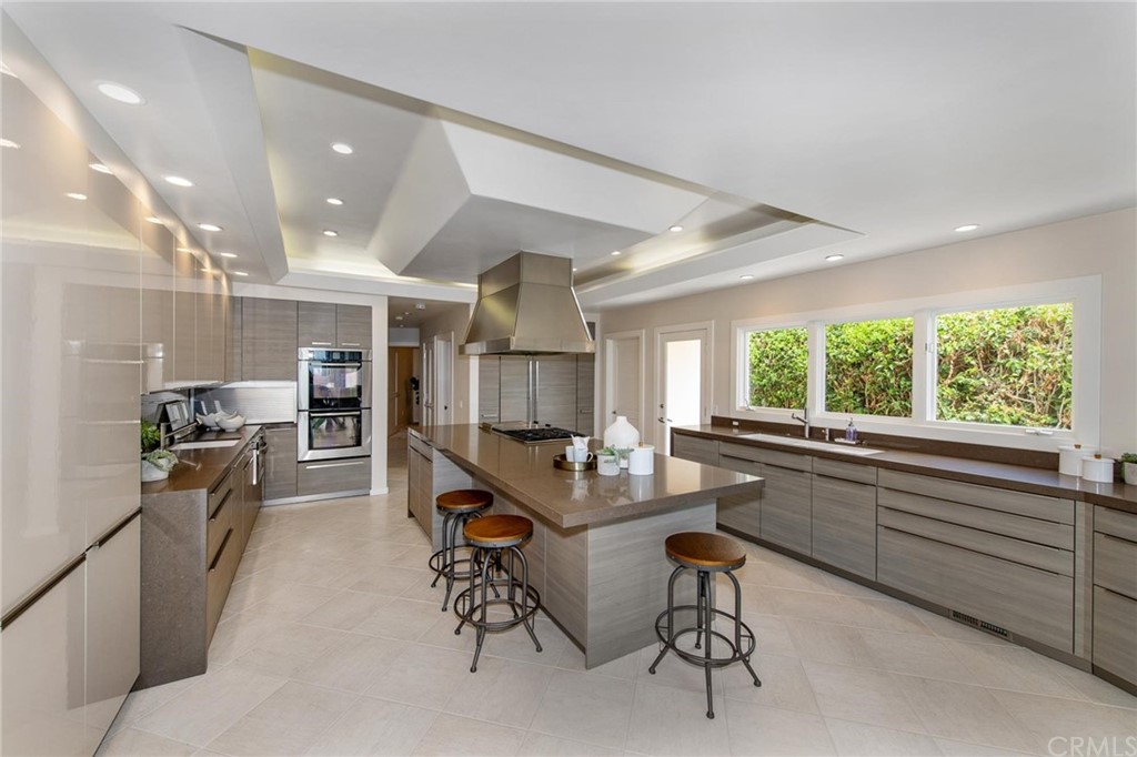 31597 Table Rock Drive Laguna Beach, CA 92651 - Photo 46 of 75 a room with stainless steel appliances kitchen island granite countertop furniture and a large window