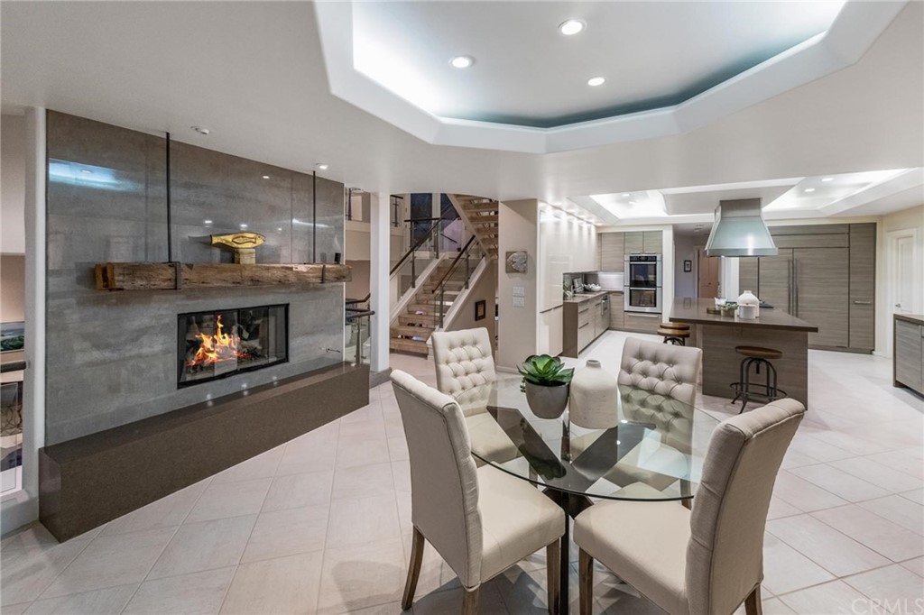 31597 Table Rock Drive Laguna Beach, CA 92651 - Photo 50 of 75 a dining room with furniture and a fireplace